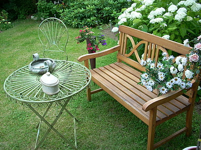 brown wooden bench and white metal patio set thumbnail