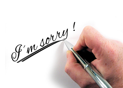 person writing using gray pen thumbnail