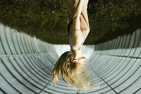 woman flipping her hair in the middle of arch thumbnail