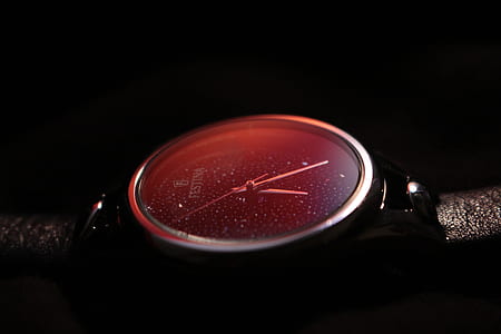 round silver-colored analog watch with black band thumbnail