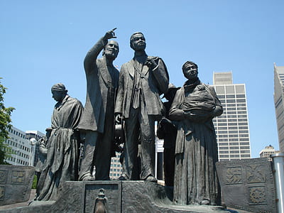 photo of five person standing statue thumbnail
