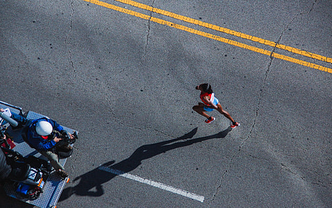 woman running on concrete road thumbnail