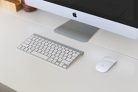silver and white Apple Magic Mouse and Apple Keyboard thumbnail