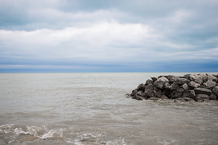 gray stones on body of water during daytime thumbnail
