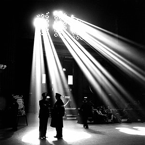 silhouette photo of people standing andsitting inside room thumbnail