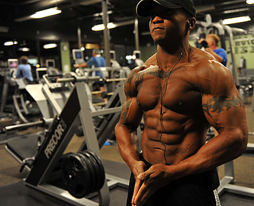 topless man wearing black curved brim cap flexing thumbnail