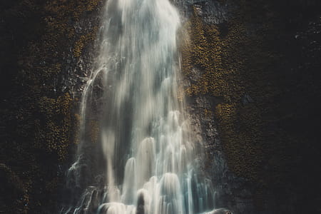 Photography of Waterfalls in Cave thumbnail