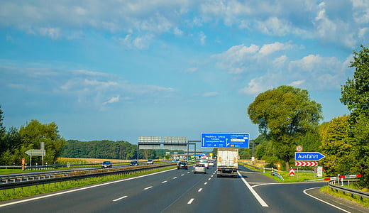 vehicles on road during daytime thumbnail