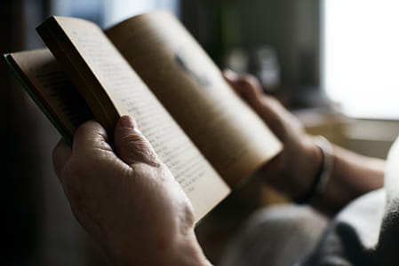 Tilt-shift Lens Photography Of Open Book thumbnail