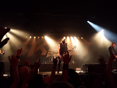 man in black sleeveless shirt holding guitar thumbnail