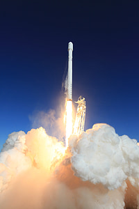 ignition of white rocket towards blue sky during daytimne thumbnail