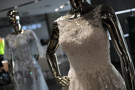 shallow photography of white sleeveless gown thumbnail