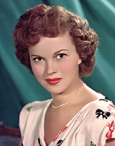 woman wearing white and red floral top thumbnail