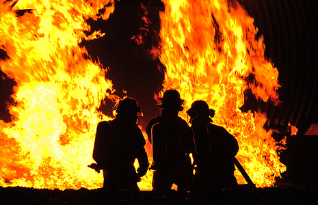 silhouette of men near fire thumbnail