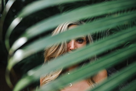 woman standing near green plants during daytime thumbnail