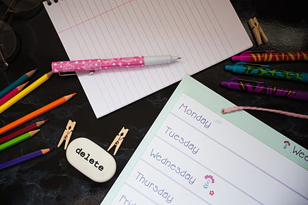pink and white pen on white paper thumbnail