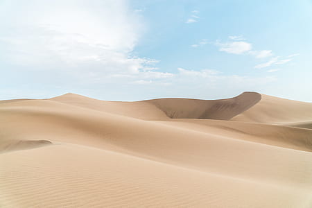 landscape photography of desert sand dune during daytime thumbnail