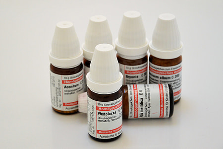six Phytolacca bottles on white surface thumbnail
