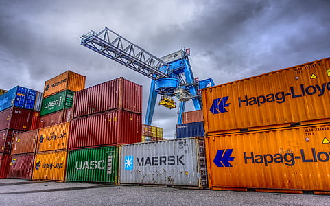 low angle photography of cargo trailer and crane thumbnail