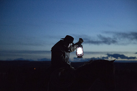 man horse riding holding lamp thumbnail