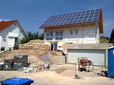 white concrete house with solar panel roofing thumbnail