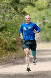 man in blue long-sleeved shirt running thumbnail