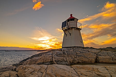 lighthouse near body of water thumbnail