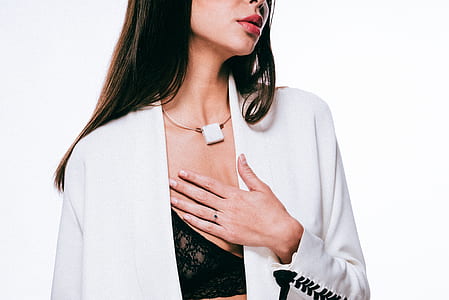 woman placing her hand of her chest while taking a picture thumbnail
