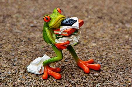 green frog carrying paper documents figurine on ground thumbnail