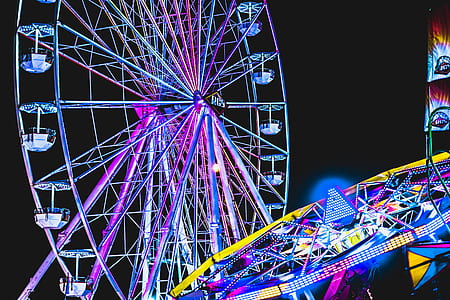 ferris wheel with lights during nighttime thumbnail