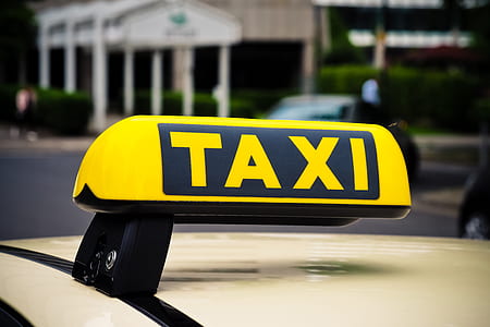 yellow and black Taxi signage thumbnail