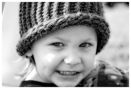 grayscale photography of boy wearing knit cap thumbnail