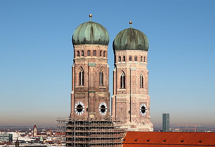 green and brown building under blue sky at daytime thumbnail