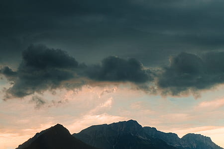 mountain range under cumulus clouds thumbnail