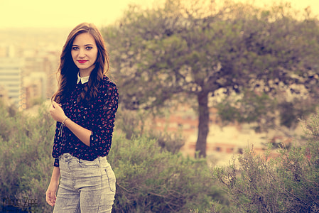 woman wears black and red floral collared long-sleeved blouse thumbnail