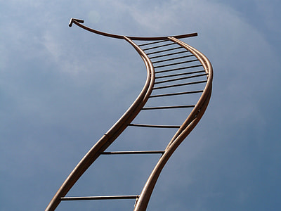 brown rattan ladder under cloudy sky thumbnail