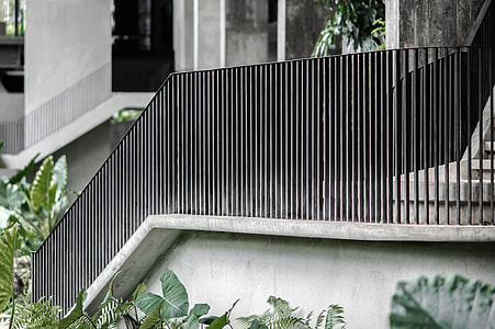 gray staircase with black handrails thumbnail