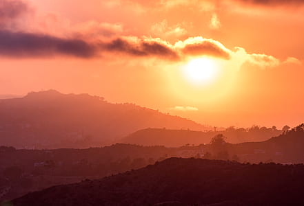 silhouette of mountain during golden hour thumbnail