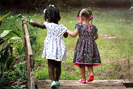 two girls walking on bridge thumbnail