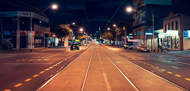 black car parked on road thumbnail