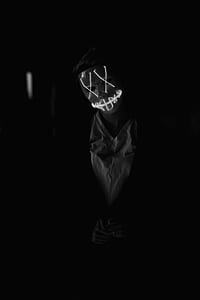 person wearing mask and white V-neck top thumbnail