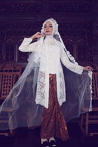 Woman Wearing White Hijab Headscarf and White and Brown Floral Lace Abaya Dress thumbnail