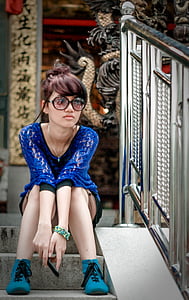 person sitting on stair wearing blue outfit thumbnail