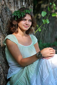 woman wearing green cap-sleeved shirt thumbnail