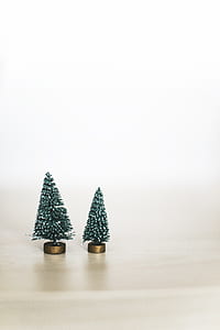 photo of two Christmas tree miniatures on white surface thumbnail