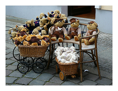assorted bear plush toy lot on brown wooden bench thumbnail
