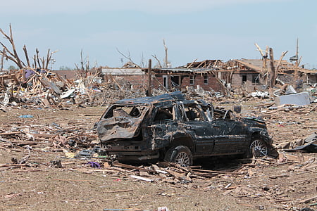 wrecked vehicle on devastated area during daytime thumbnail
