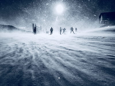 group of people standing on snow thumbnail