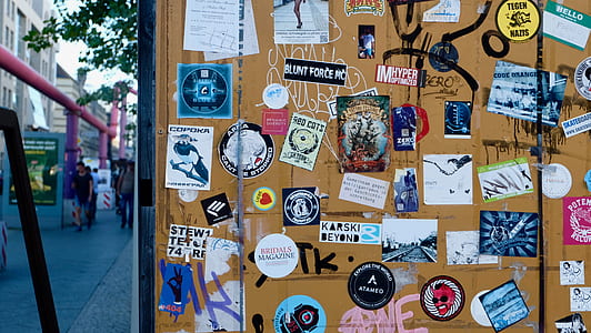 assorted sticker on brown steel surface thumbnail