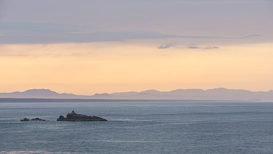landscape photography of islet in sea thumbnail